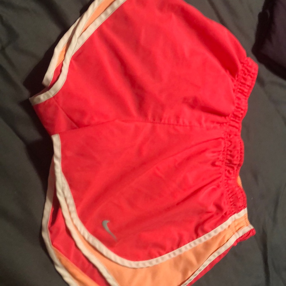 Pink Nike running shorts